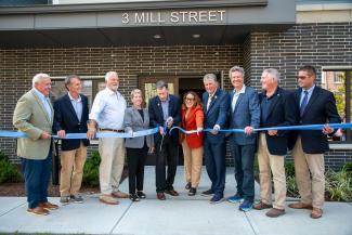 Governor McKee joins housing officials at grand opening.